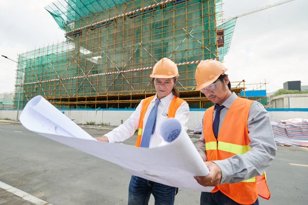 Graduates of civil engineering working on site.